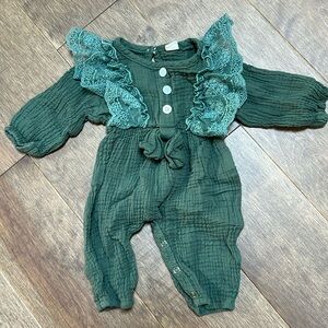 Green romper with ruffles